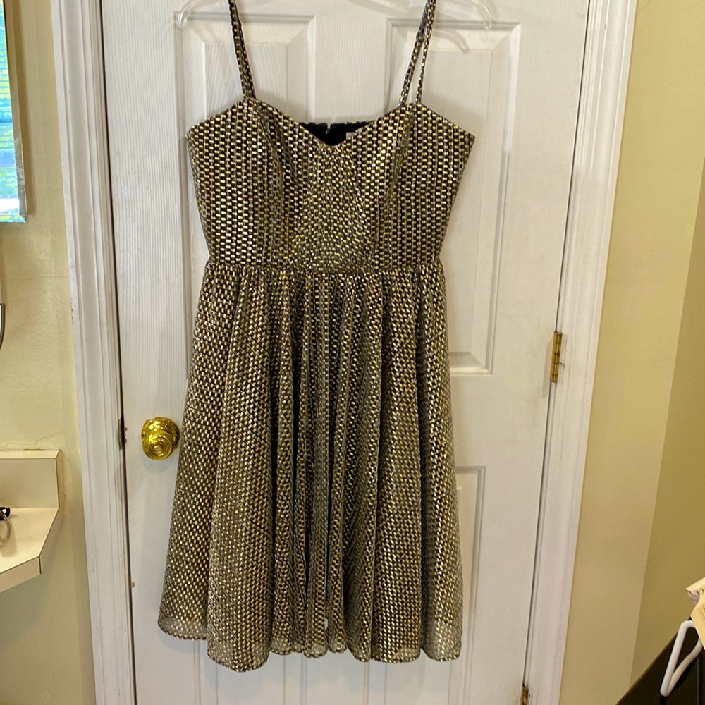 Dress The Population! Adjustable straps! Metallic gold and black.